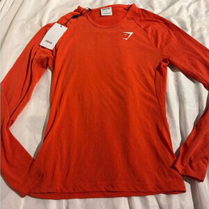 Gymshark Women’s Orange Long Sleeve Shirt Nylon Blend Stretch Breathable Gym NWT